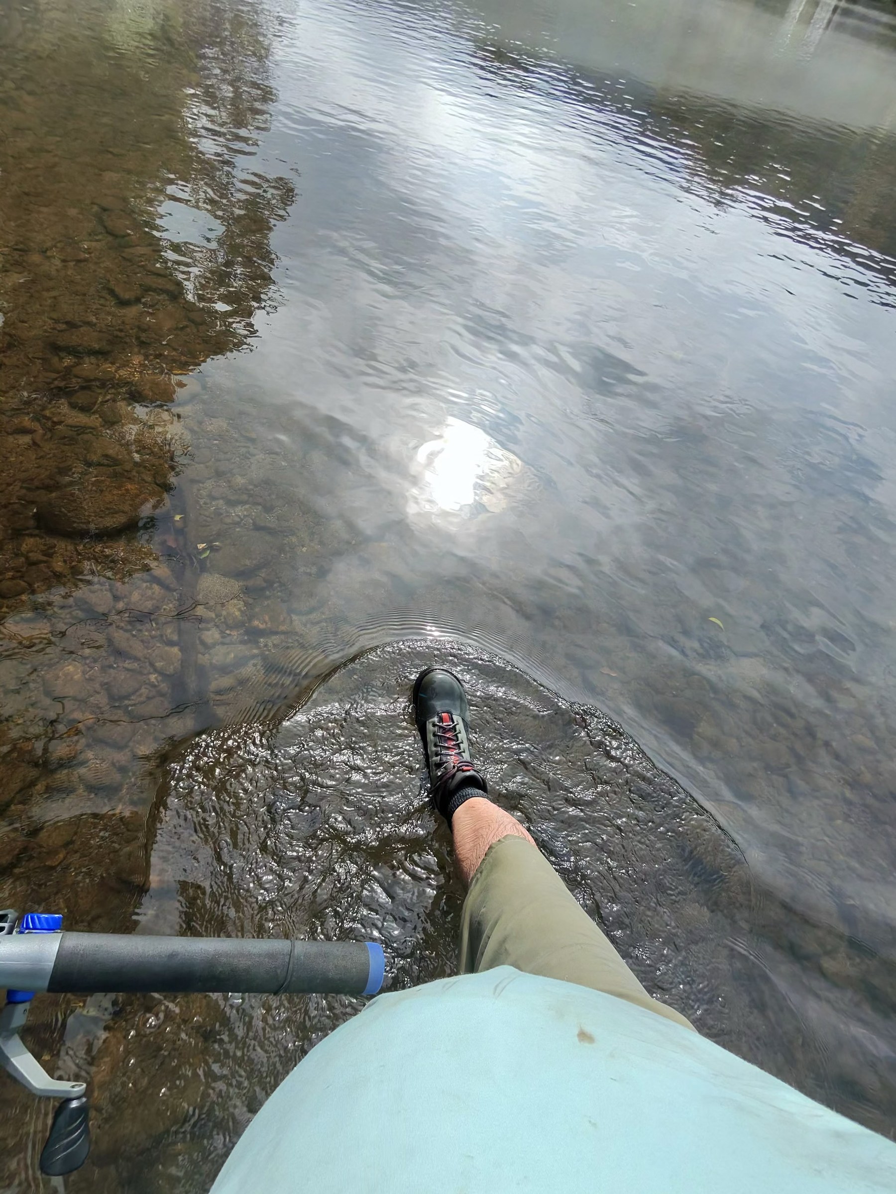 Stepping into clear water off the River House dock