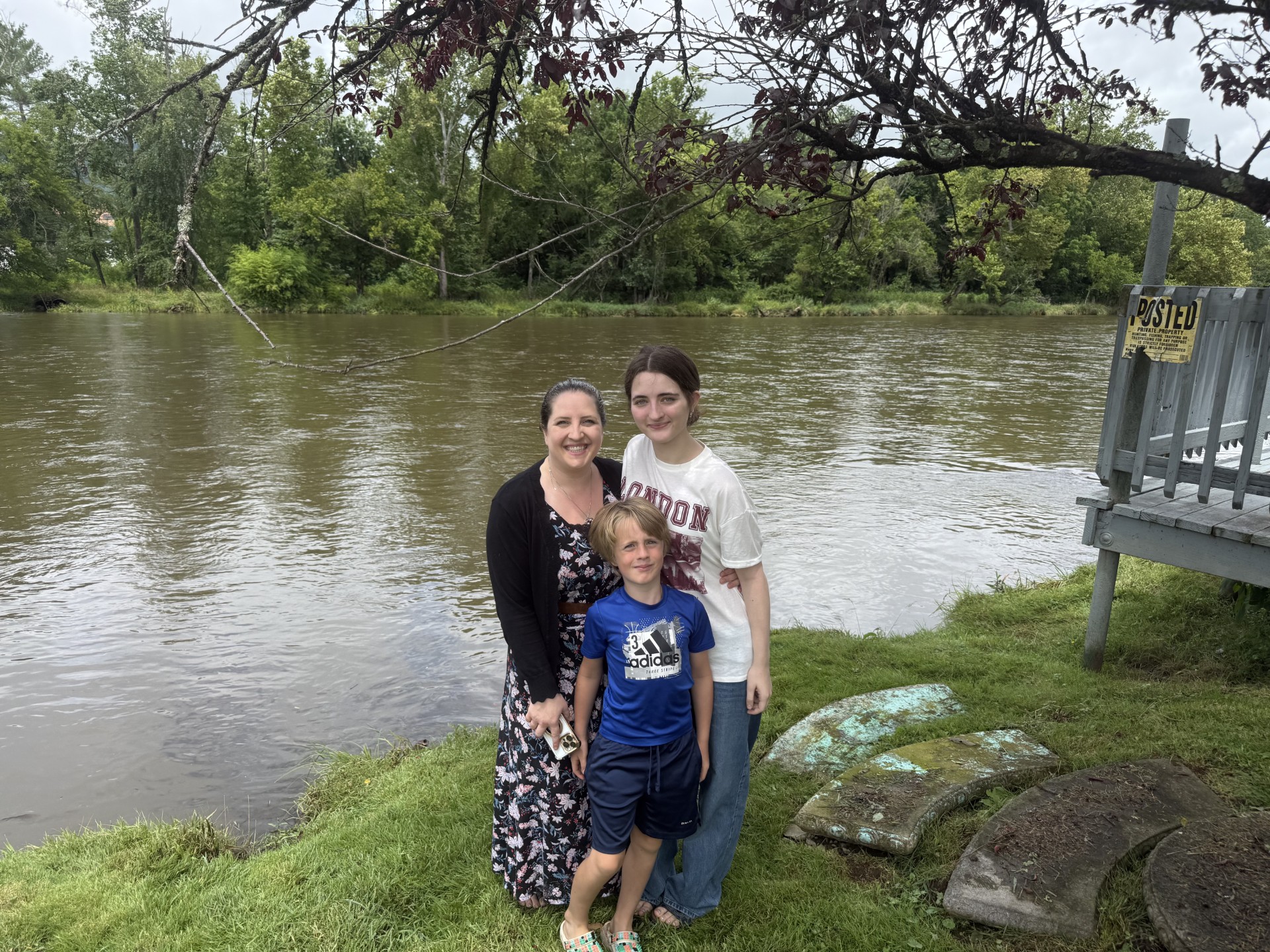 Family on the bank by the dock at 1399 Broad