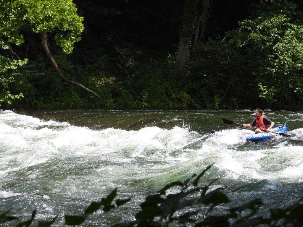 Blue kayak in whitewater below Wilbur
