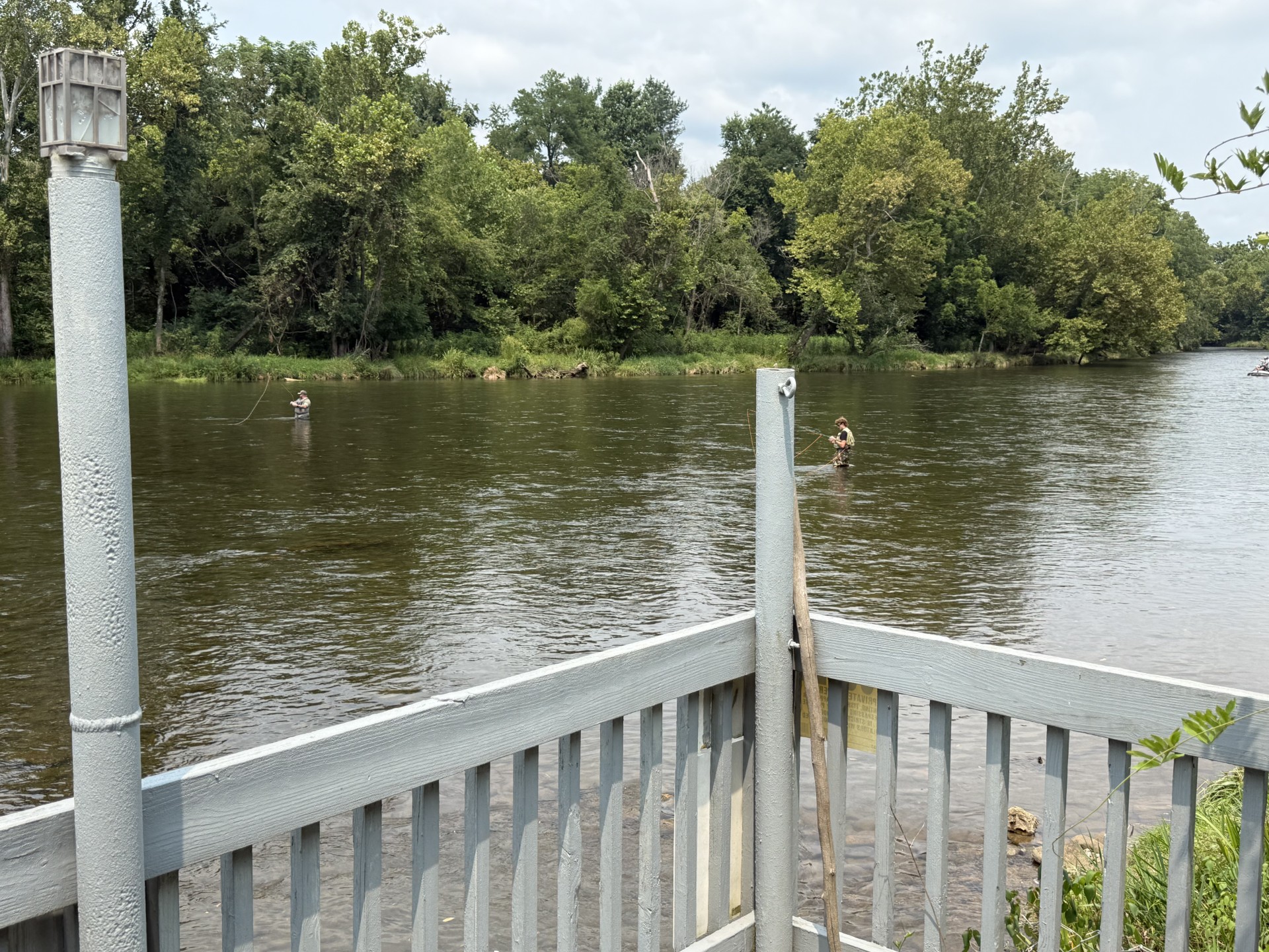 River from the porch — two waders on the Watauga
